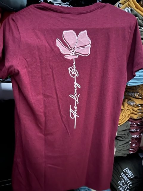 Looney bin flower design on the back of a wine vneck shirt